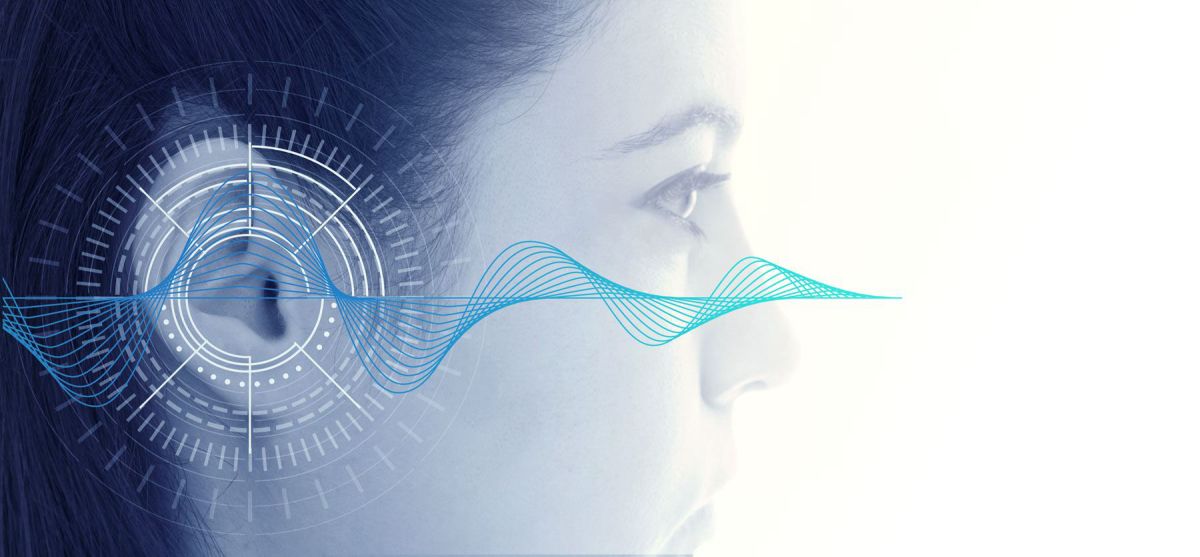 Profile of a woman's head overdrawn with a representation of a soundwave passing through a stylised outline of an earphone over her ear